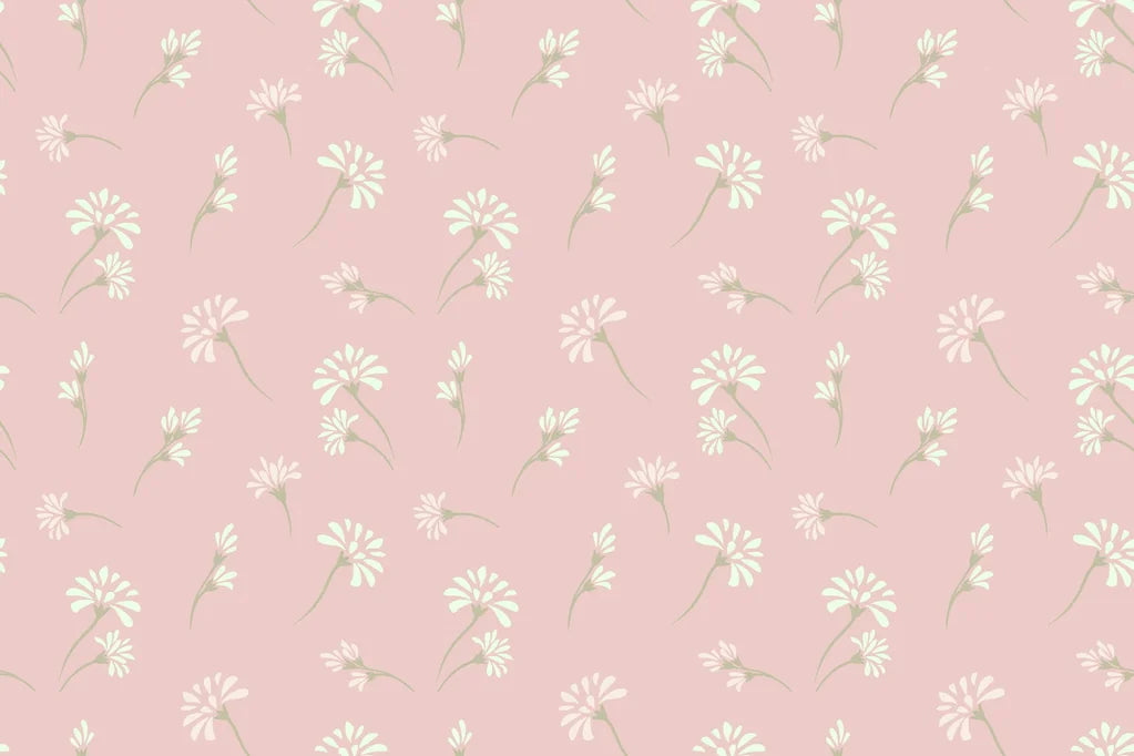 Self-adhesive, removable wallpaper featuring a ditsy pattern of pink and white flowers
