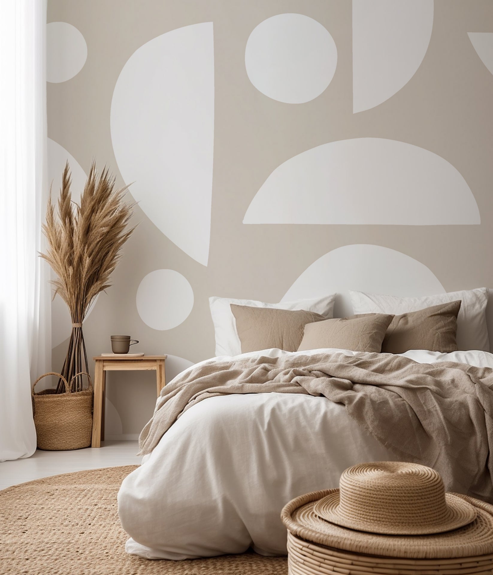 Abstract geometric wallpaper with white organic shapes and half circles scattered across a warm beige background.