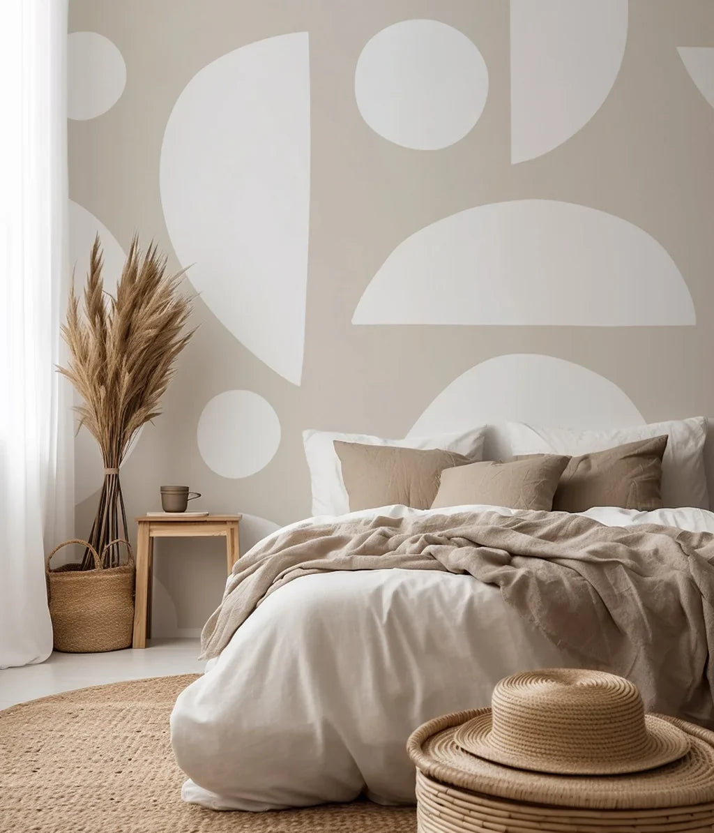 Dispersed white free-form shapes and arcs decorating an abstract wallpaper with a warm beige color scheme
