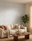 Ghost Fronds pale palm wallpaper in a warm and inviting living room