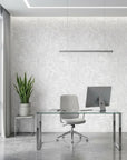 Ghost Fronds pale palm wallpaper as a feature wall in a bright home office