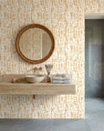 Gold and cream Gilded Brushstroke peel and stick wallpaper in modern spa bathroom with floating vanity