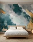 Gilded Sweep elegant teal and gold abstract wallpaper in a warm and inviting living room