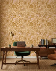 Gilded Tapestry warm gold paisley floral wallpaper adding character to a cozy bedroom