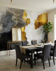 Gilded Thunder gold and charcoal abstract wallpaper as a feature wall in a bright home office