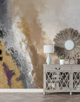 Abstract gold, gray, and burgundy brushstroke wallpaper creating textured artistic accent wall in modern entryway