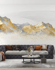 Gold and gray mountain range wallpaper with metallic speckles on modern living room wall