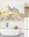 Gold and grey Gold Peaks mountain mural wallpaper in modern spa bathroom with freestanding tub
