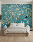 Teal and gold Golden Blossoms wallpaper with almond branches on modern bedroom accent wall