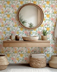Self-adhesive wallpaper featuring a pink and yellow watercolor floral pattern, known as Golden Blush