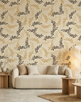 Golden Boughs elegant gold leaf wallpaper in a warm and inviting living room