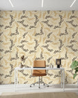 Golden Boughs elegant gold leaf wallpaper as a feature wall in a bright home office