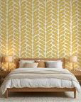 Golden Coral mustard geometric peel and stick wallpaper adding character to a cozy bedroom