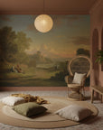 Golden Hour Valley pastoral mural wallpaper in terracotta room with peacock chair and natural textures