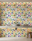 Happy Chaos colorful cutout alphabet letter wallpaper creating ambiance in a serene bathroom