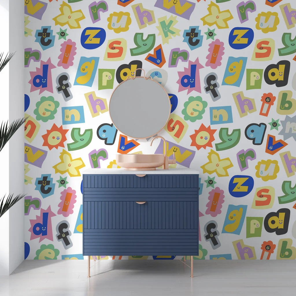 Eclectic scrapbooked alphabet wall covering with a rainbow of paper textures and vintage font styles - Happy Chaos