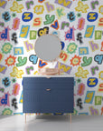 Eclectic scrapbooked alphabet wall covering with a rainbow of paper textures and vintage font styles - Happy Chaos