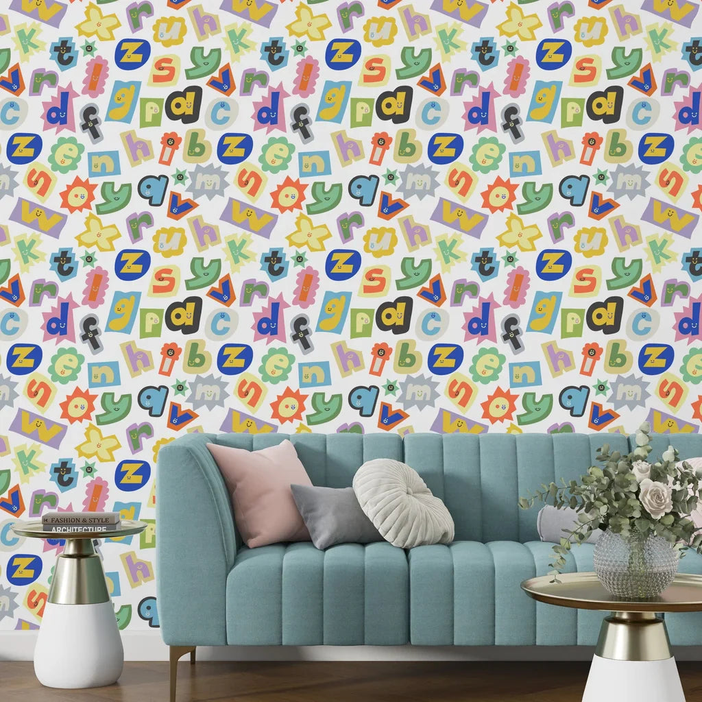 Bold pop art wallpaper displaying a dense mosaic of colorful newspaper-style letter clippings - Happy Chaos