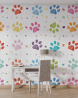Vibrant multi-colored crayon-style animal tracks scattered across a flat white self-adhesive wall covering - Happy Tracks