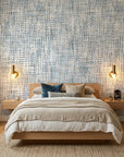 Blue and beige Harbour Weave textured wallpaper on modern bedroom accent wall with warm lighting