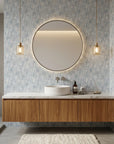 Gray and cream Harbour Weave textured wallpaper in modern bathroom with floating vanity and brass pendant lights