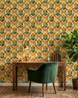Harvest Mosaic bold orange green and gold geometric wallpaper adding character to a cozy bedroom