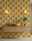 Harvest Mosaic bold orange green and gold geometric wallpaper as a feature wall in a bright home office