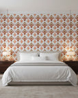 Harvest Glow Ikat bold amber tribal wallpaper adding character to a cozy bedroom