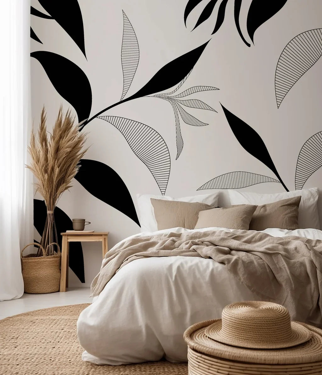Black, finely sketched plant life and undulating leaves patterned against a soft, creamy ivory wallpaper