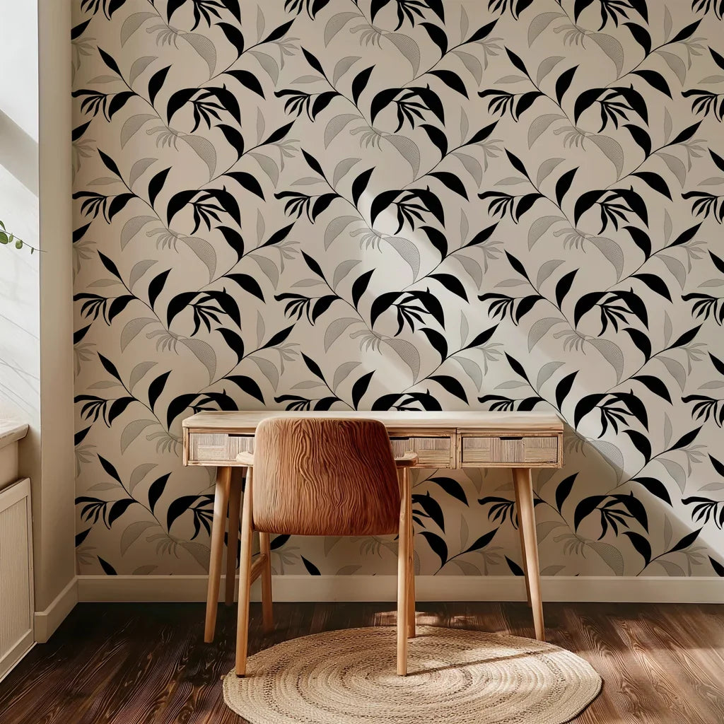 Non-representational wall paper design showcasing dark, dynamic foliage and thin-line black sketches contrasting with a warm ivory surface