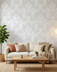 Heirloom Rose Medley soft grey and white damask wallpaper in a warm and inviting living room