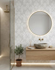 Heirloom Rose Medley soft grey and white damask wallpaper creating ambiance in a serene bathroom