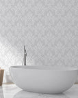Gray damask Heirloom Rose Medley peel and stick wallpaper in elegant bathroom setting with freestanding tub