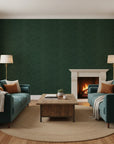 Hidden Understory dark green botanical wallpaper in a warm and inviting living room