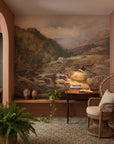 Hilltop Manor landscape mural wallpaper featuring mountain stream scene in terracotta-walled reading nook