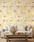Honey Blooms yellow bumblebee and honeycomb wallpaper in a warm and inviting living room