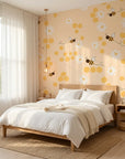 Honey Blooms yellow bumblebee and honeycomb wallpaper adding character to a cozy bedroom
