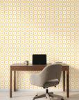 Honey Ikat golden geometric peel and stick wallpaper as a feature wall in a bright home office