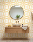 Honey Ikat golden geometric peel and stick wallpaper creating ambiance in a serene bathroom