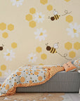 Removable wallpaper featuring yellow bees, beehive shapes, and botanical blooms - Honey Blooms