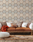 Self-adhesive wallpaper featuring a faux beige and brown geometric hexagon tile pattern, named Honeycomb Drift