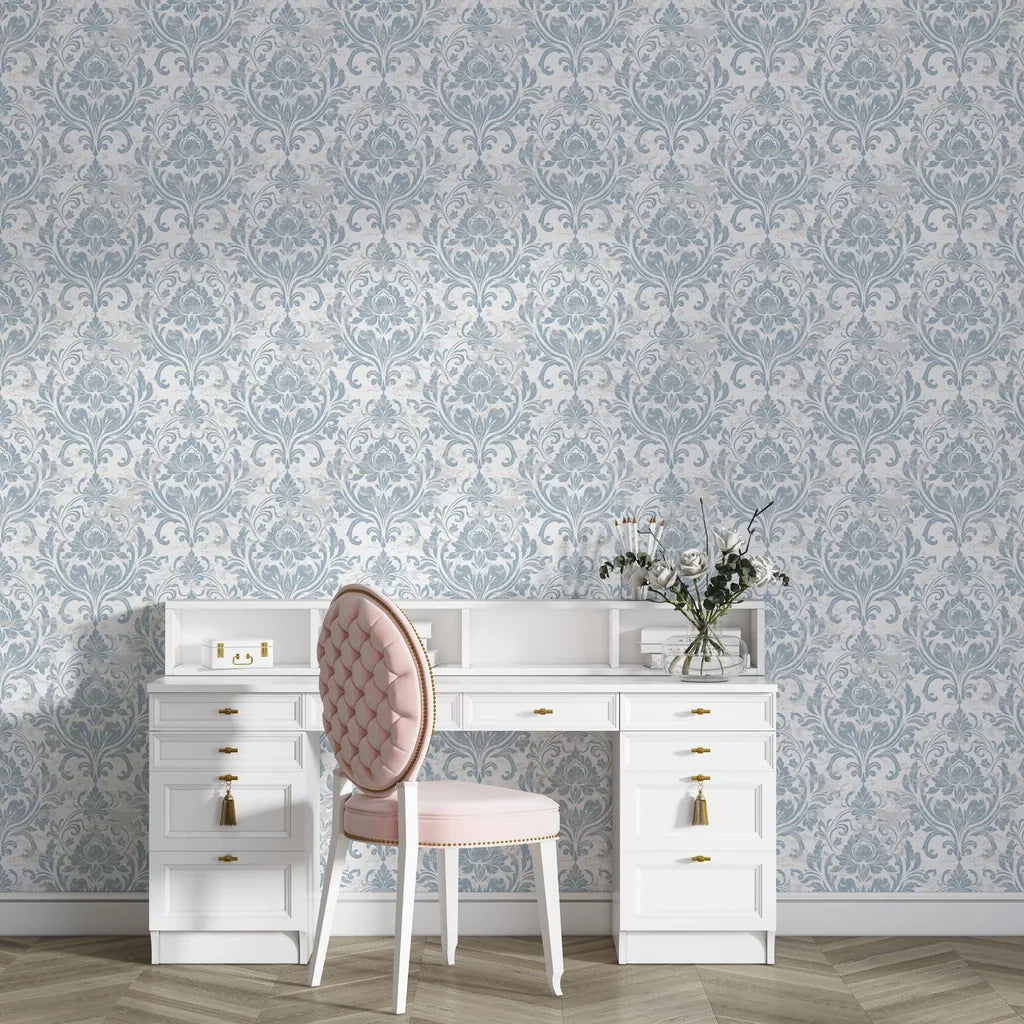 Honeyed Petal Mural damask wallpaper in soft blue and cream tones behind white vanity desk