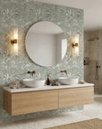 Hush & Palm sage green palm tree creating ambiance in a serene bathroom