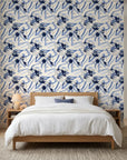 Indigo Anemone bold blue botanical floral wallpaper adding character to a cozy bedroom