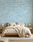 Indigo Current serene blue abstract wallpaper in a warm and inviting living room
