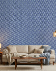 Blue and indigo Indigo Labyrinth geometric wallpaper with interlocking circles in modern living room setting