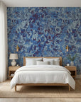 Indigo Static blue and navy abstract distressed texture wallpaper adding character to a cozy bedroom