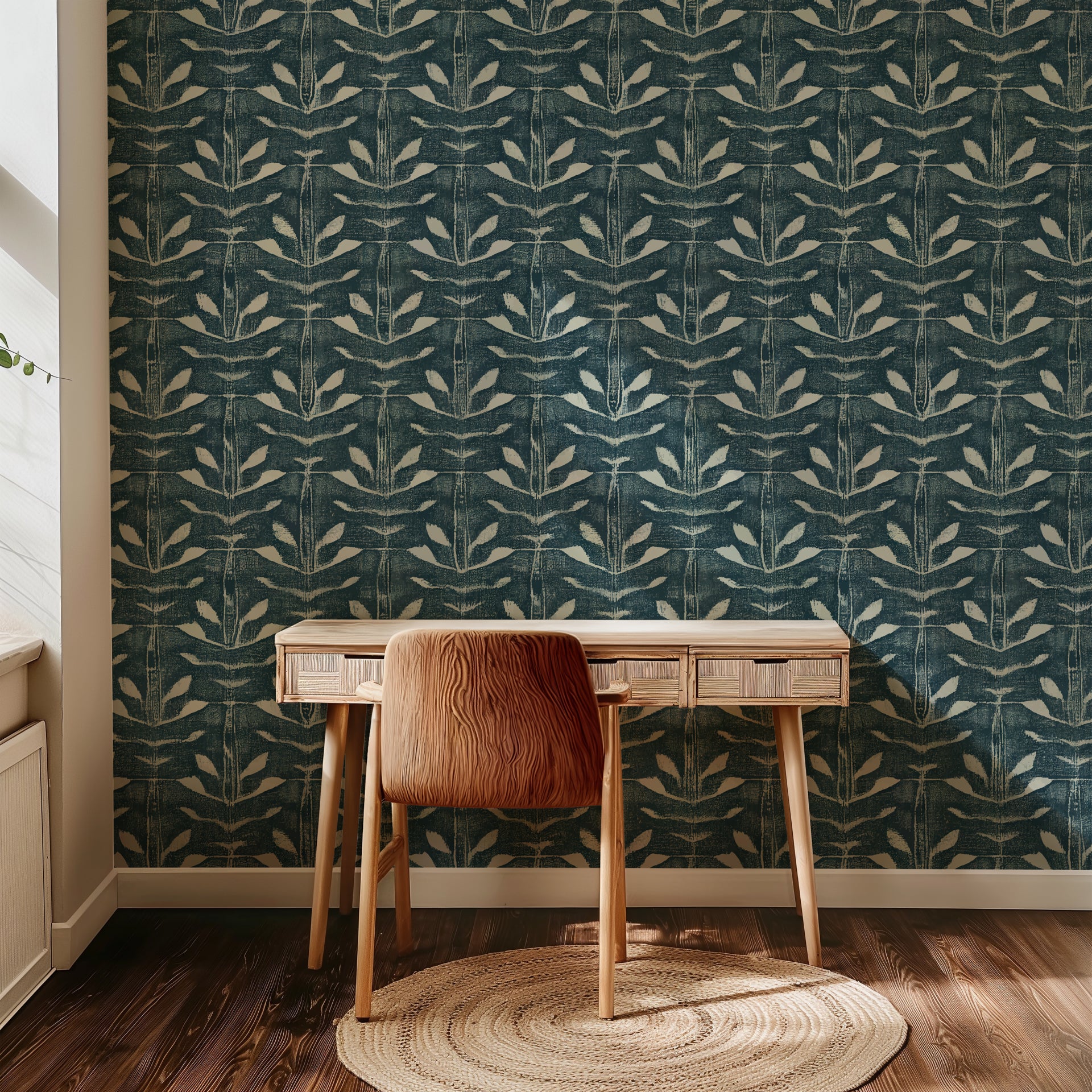 Teal blue hand painted wallpaper with repeating abstract leaf shapes and layered textured brush strokes.