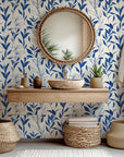 Simple blue leaf illustrations on cream-toned peel and stick wallpaper