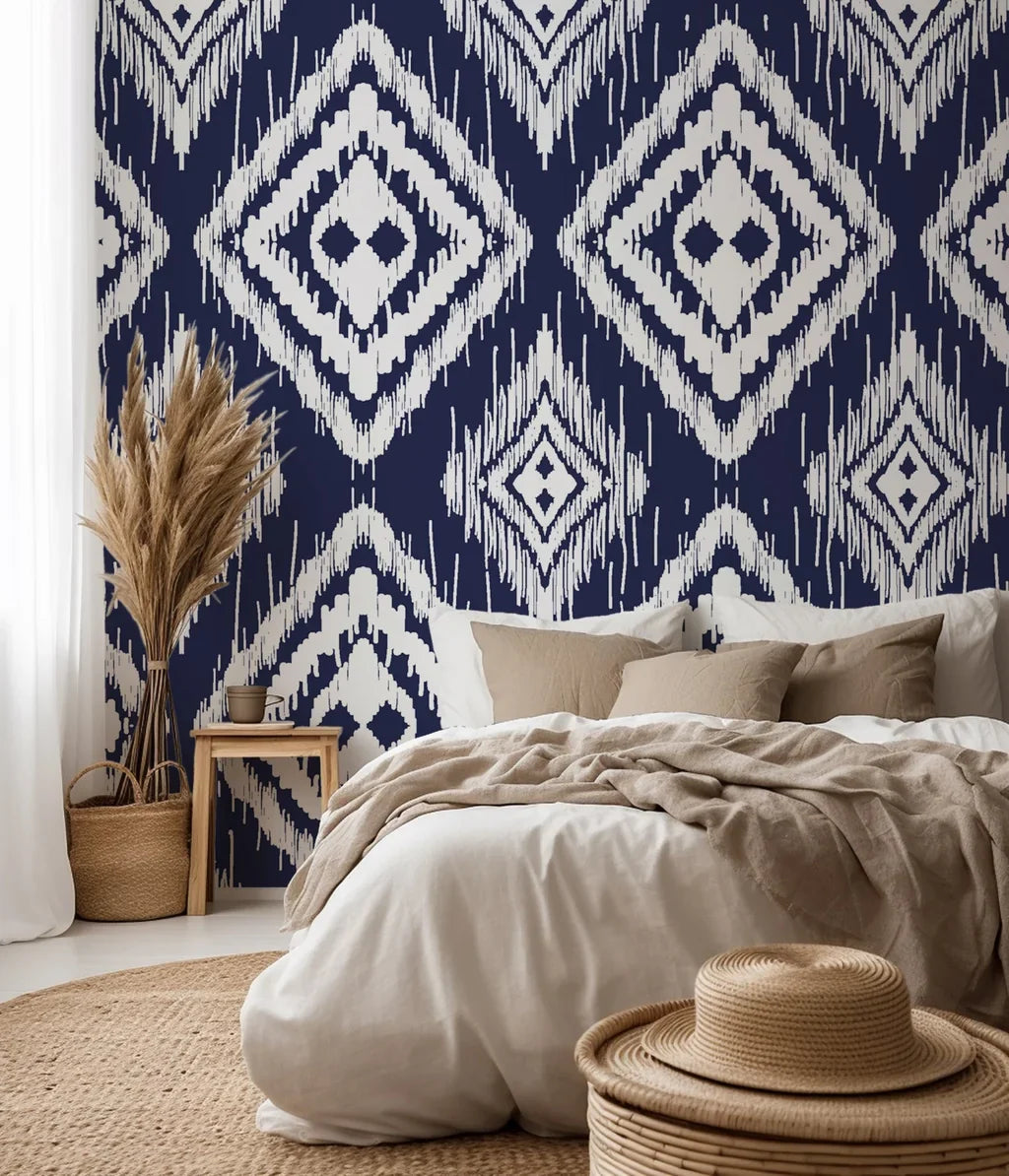 A textured, hand-painted wallpaper featuring navy blue ikat styling and a pattern of repeated white diamond icons